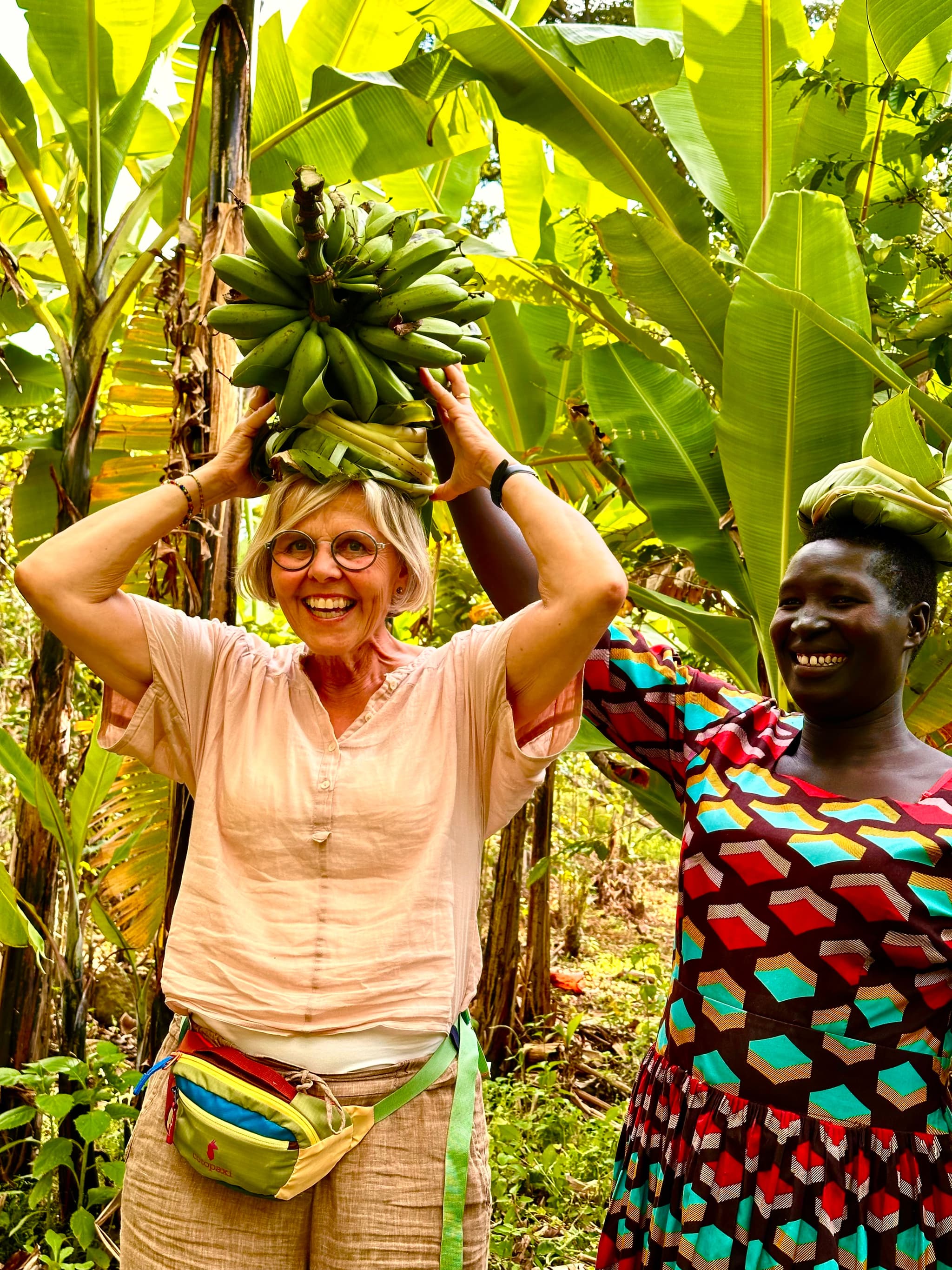 Carrying Matoke during a Cooking with the Kapchowa Mamas Experience - photo credit 'Shadrack Chebet' (Sebei Cultural Storytellers).jpg (1)-1758111273102.jpg
